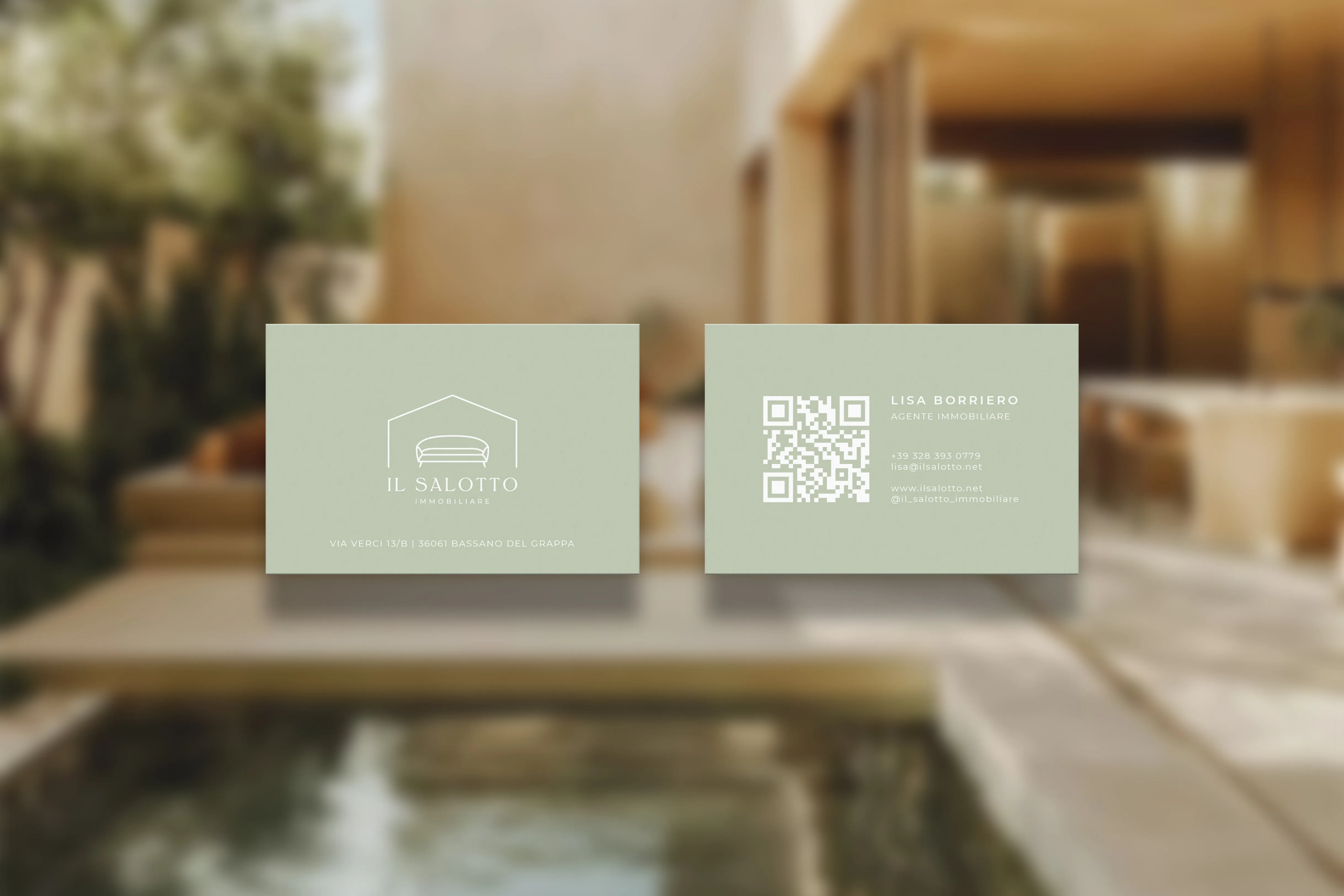 Front and back of sage green Il Salotto Immobiliare business cards